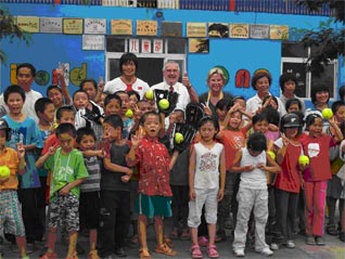 ISF President Don Porter with orphaned children in Beijing Tuesday