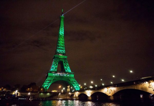 Eiffel Tower in Paris lit up green to mark beginning of the Paris Agreement