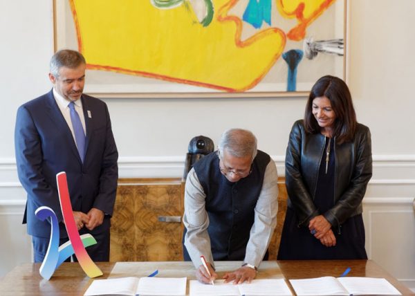 (L to R) Paris 2024 CEO, Etienne Thobois, Founder of the Yunus Centre and Nobel Peace Prize winner, Professor Muhammad Yunus and Mayor of Paris, Anne Hidalgo, at the signing of the partnership agreement between Paris 2024, the City of Paris and the Yunus Centre