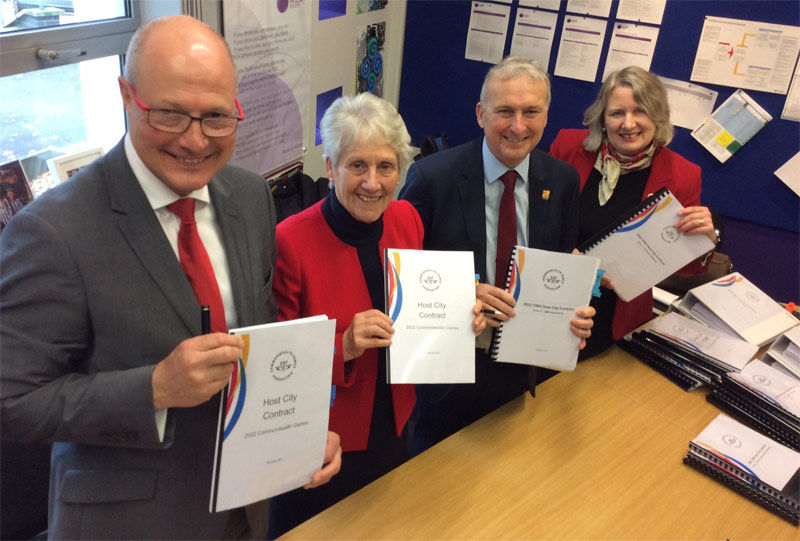Officials, including Birmingham Mayor Andy Street, hold signed copies of the 2022 Commonwealth Games Host City Contract (Birmingham 2022 Photo)