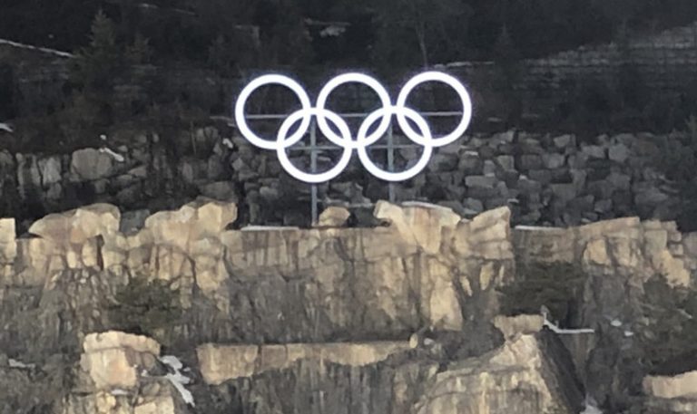 Olympic Rings hang cliffside overlooking PyeongChang 2018 Ski Jump venue (GamesBids Photo)