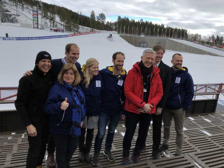 IOC Evaluation Commission Chief Octavian Morariu (red jacket) with IOC Executive Director Christophe Dubi (left) and Stockholm-Åre bid Chief Richard Brisius (2nd left) at Lugnet Nordic Complex in Falun, Sweden (GamesBids Photo)